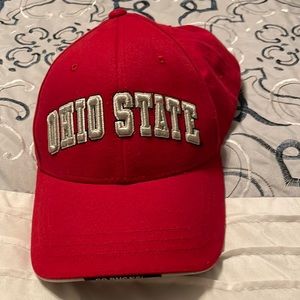 Ohio state hat with the Ohio state insignia on it has the o on the back